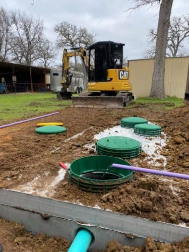 Septic system in ground being filled with water