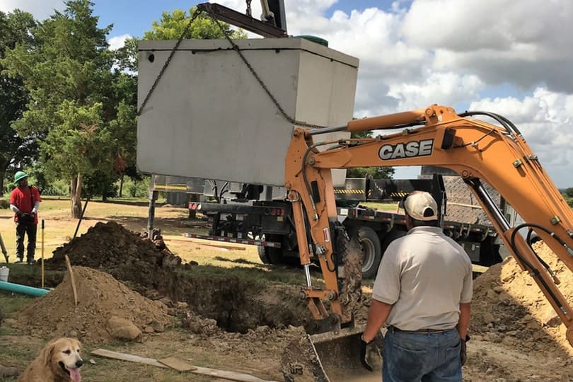 Man in front of excavator